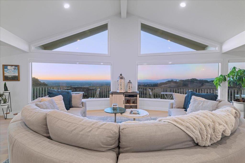Prepare to be amazed! Breathtaking views as you enter through the custom built door; your Silicon Valley Sanctuary awaits. Relax as the sun goes down and the valley lights come up. Incredible location with both privacy and proximity; 2 minutes to top rated Los Gatos Schools, a few more to vibrant downtown Los Gatos with Michelin noted dining, shopping, library and Farmers' Market. This custom built home is stunning, move-in condition with over $250,000 in improvements. The kitchen was remodeled with quartz counters, designer backsplash, Miele appliances and lighting. The centerpiece of the kitchen is a fabulous island with waterfall edges and view of the Valley of Our Heart's Delight. Gorgeous new white oak hardwood floors throughout, new light fixtures, expansive remodeled master suite with a private balcony, 3 additional bedrooms and an entertainment/family room create the perfect living space for all! Multiple entertaining and seating areas, inside and out with wrap around Trex decking-perfect for our much envied year round California weather. A custom built play structure with turf is nestled under the trees, there is parking for 6 or more cars in addition to the attached garage. This is what Los Gatos living is all about; truly an opportunity of a lifetime!!!