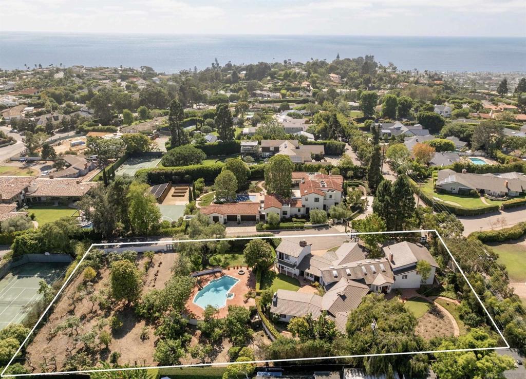 One-Of-A-Kind "Rancho La Jolla" Estate Property. Cherished by the same family for six decades, this extraordinary estate graces 1.23 prime acres. A rare opportunity to create your own legacy in one of La Jolla's most desirable enclaves nestled in privacy and seclusion. The grand, "Rancho La Jolla" estate features a 6,338 square foot classic Ranch Style residence surrounded by mature landscaping with multiple courtyards/seating areas to enjoy the serenity and quietude of the park-like-resort-style setting. See supp... Rancho La Jolla was tastefully remodeled over the years for the growing, 4th generation La Jolla family to take full advantage of San Diego's ideal indoor-outdoor climate and includes expansive windows and doors opening to the sun-drenched patios. Grand entertaining spaces include a formal living room, dining room, entry bar, music room, library, and executive office that complement the oversized Great Room family-kitchen-dining area, accented by Italian tile flooring. With six bedrooms and 4.5 bathrooms, the home the home lives like a single-story, and provides ideal spaces to entertain and retreat. Four gas and wood-burning fireplaces create a cozy and inviting ambiance. The gated, 3-car garage and motor court can be accessed from both La Jolla Rancho Road or Buckingham Road, providing an array of uses and development options for the new owners.