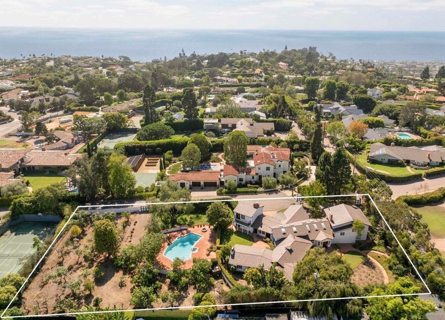 One-Of-A-Kind "Rancho La Jolla" Estate Property. Cherished by the same family for six decades, this extraordinary estate graces 1.23 prime acres. A rare opportunity to create your own legacy in one of La Jolla's most desirable enclaves nestled in privacy and seclusion. The grand, "Rancho La Jolla" estate features a 6,338 square foot classic Ranch Style residence surrounded by mature landscaping with multiple courtyards/seating areas to enjoy the serenity and quietude of the park-like-resort-style setting. See supp...  Rancho La Jolla was tastefully remodeled over the years for the growing, 4th generation La Jolla family to take full advantage of San Diego's ideal indoor-outdoor climate and includes expansive windows and doors opening to the sun-drenched patios. Grand entertaining spaces include a formal living room, dining room, entry bar, music room, library, and executive office that complement the oversized Great Room family-kitchen-dining area, accented by Italian tile flooring. With six bedrooms and 4.5 bathrooms, the home the home lives like a single-story, and provides ideal spaces to entertain and retreat. Four gas and wood-burning fireplaces create a cozy and inviting ambiance. The gated, 3-car garage and motor court can be accessed from both La Jolla Rancho Road or Buckingham Road, providing an array of uses and development options for the new owners.