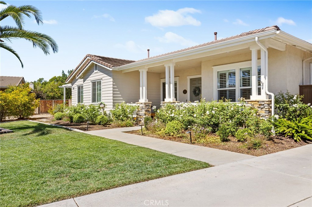 Rare Plan 1 on Over Half an Acre with Covered RV Parking, Workshop, and Paid-Off Solar! Welcome to the highly sought-after Ranchos Community, where every home is single story. This hard-to-find Plan 1 sits on a sprawling 24,393 sq ft (.56 acre) cul-de-sac lot and offers incredible versatility with a detached 3-car garage, covered RV parking, and a separate 15’ x 20’ garage/workshop—plus additional space for boat parking or more toys. There’s plenty of room to customize your outdoor living: add a casita, pool, sports court, or expansive garden.
Inside, you’ll find 2,155 sq ft of single-level living with 4 bedrooms, 2 bathrooms, and soaring 10-ft ceilings throughout. The spacious kitchen with builder-option stovetop flows into the inviting family room, now featuring a stunning floor-to-ceiling stone fireplace, wood shutters, and abundant natural light. Flooring throughout includes durable vinyl plank and carpet in select areas, complemented by ceiling fans in nearly every room for year-round comfort.
The primary suite is bright and spacious, offering private access to the backyard. Enjoy a large front porch with peaceful views, a chicken coop ready for fresh eggs, and an oversized yard with endless possibilities.
Additional highlights include: paid-off solar system, generous driveway parking, and a location that’s walking distance to the junior high and high school, with quick access to shopping, dining, and freeways. And with no HOA, you’ll enjoy freedom and flexibility to truly make this property your own.
This rare Ranchos opportunity combines space, function, and upgrades in one of the area’s most desirable neighborhoods. Whether you need parking for your RV, a workshop for projects, or simply room to spread out, this property delivers it all. Don’t miss your chance to own a home that checks every box!