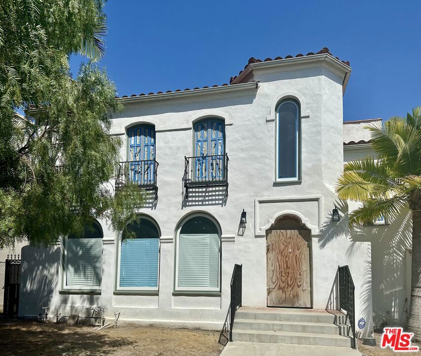 Don't miss this rare opportunity to own a charming, character-filled duplex in the highly desirable Miracle Mile neighborhood. Each spacious unit offers 3 bedrooms and 2 bathrooms, blending timeless details with recent updates, including all-new electrical with a new electrical panel and completely new plumbing installed throughout the duplex. All work is fully permitted. There's still room to add your personal touch and elevate the property even further. Located on a quiet, tree-lined street, this property also features a detached 4-car garage offering potential for ADU conversion (buyer to verify). Perfectly situated near The Grove, LACMA, La Brea Tar Pits, and an array of dining and shopping destinations. Ideal for both investors and owner-users, this is a unique opportunity to own a property with strong income potential and long-term value in one of L.A.'s most sought-after areas.