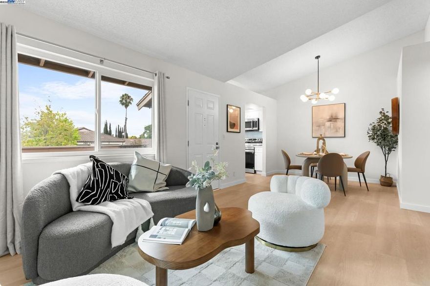 Beautifully remodeled 2BD/2BA top-floor condo in Fremont’s Warm Springs district—a rare find under $600K! This move-in-ready home offers soaring ceilings, a bright open floor plan, and water-resistant SPC flooring throughout. The modern kitchen features updated cabinetry, stainless-steel appliances, and sleek finishes. The spacious primary suite includes a remodeled bath and generous closet, while the second bedroom enjoys high ceilings and great natural light. Additional highlights: Private porch with hills views perfect for morning coffee and evening relaxation. With in-unit laundry, central heating & A/C, private porch, and dedicated carport with storage. The HOA covers water, trash, common-area maintenance, and building insurance for peace of mind. Prime location—walk to James Leitch & Warm Springs Elementary and Fremont BART. Near Irvington High (10/10), Auto Mall shops, Walmart, Costco, Ranch 99, Osaka Market, Safeway, and quick access to I-680, I-880, and major tech employers. Open Sat 10/11, 1-4PM.