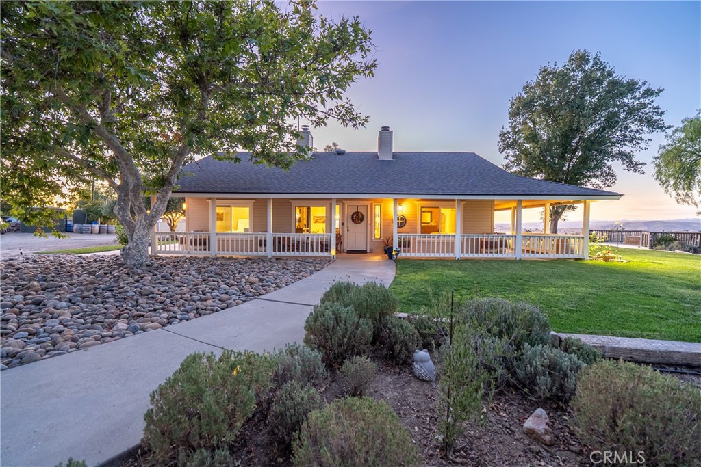 Experience the quiet luxury of vineyard living on this 19.77± acre estate in Paso Robles wine country. Located at the end of a peaceful road just minutes from downtown and Highway 101, this West San Miguel retreat offers breathtaking panoramic views and the opportunity to bring your dreams to life.
At the heart of the property is a professionally managed 15± acre vineyard planted with Cabernet Sauvignon, Cabernet Franc, and Petit Verdot. Recently replanted and currently contracted with Tobin James, the vineyard is powered by solar, nourished by automated irrigation, and monitored with Tule moisture sensors and remote-access controls—allowing you to oversee operations from anywhere.
The 1,500± sq. ft. ranch-style home offers warmth and functionality with 2 bedrooms, 2 remodeled bathrooms, hardwood floors, and a well-equipped country kitchen including stainless steel appliances, a Shaw farm sink, soapstone counters, and a center island ideal for casual entertaining. A dedicated office supports remote work or creative pursuits, while additional features include owned home solar, a new roof, Milgard windows and sliders, a Pacific Energy wood stove, and an updated well system.
Step outside to a wraparound porch and elevated viewing decks that invite you to relax and savor the vineyard landscape. Additional amenities include a spacious shop, a horse stall with equestrian potential, an automated entry gate, 8-foot deer fencing, and two 7,000-gallon water storage tanks.
Whether you’re seeking a full-time residence, weekend escape, or short-term rental opportunity, this property offers a compelling blend of tranquil seclusion, vineyard views, and income potential in Paso Robles’ premier winegrowing region.