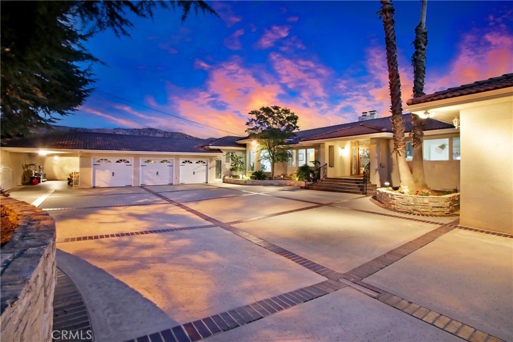 8800 Avenida Miravilla, Cherry Valley, CA 92223
Welcome to this remarkable custom-built estate nestled on 1.36 acres in the serene community of Cherry Valley. Offering 5 bedrooms, 3.5 bathrooms, and over 5,500 sq. ft. of living space, this home is the perfect blend of luxury, comfort, and sustainability.
From the moment you arrive, the private gated entrance, circular rotunda driveway, and 3-car garage set the tone for elegance and convenience. The property is fully fenced, ensuring both privacy and peace of mind. Outdoors, enjoy panoramic views, an in-ground pool, and a spacious RV parking pad (68 ft x 12 ft) with dump connection—ideal for adventure seekers. Several mature fruit trees enhance the natural beauty of the grounds, creating a tranquil setting to enjoy year-round.
Inside, the residence showcases a thoughtful array of upgrades designed to enhance modern living:
• State-of-the-Art Solar Power System – 63 solar panels with a high-capacity backup battery provide energy independence.
• EV Charging Station – Conveniently charge your electric vehicle at home.
• New HVAC & Custom Ductwork – Enjoy ultimate comfort and efficiency throughout the year.
• Gourmet Chef’s Kitchen – Recently remodeled with a Thermador downdraft range hood, custom built-in Thermador refrigerator, induction cooktop, and premium stainless steel appliances.
• Spa-Inspired Bathrooms – Fully renovated with modern finishes, elegant tilework, and luxurious fixtures.
• Rich Hardwood Flooring – Spanning all bedrooms, hallways, and main living spaces.
• Designer Touches – Custom lighting fixtures and ceiling fans throughout add both style and functionality.
• Smart Water Protection – Moen Flo Smart Water Monitor with 24/7 leak detection and automatic shutoff for added security.
• New Roof Installed (March 2017) – Offering long-term peace of mind.
This is more than just a home—it’s a modern retreat designed for sustainable living and elegant entertaining. Whether you’re relaxing by the pool, hosting in the chef’s kitchen, or enjoying breathtaking views from your private hillside, this property delivers an unparalleled lifestyle in one of Cherry Valley’s most desirable locations.