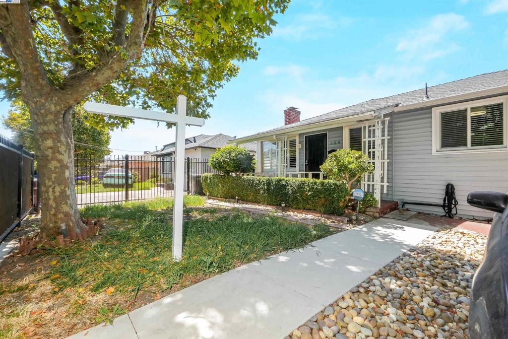 A perfect fixer opportunity in Oakland’s Sobrante Park neighborhood! This single-level home offers 2 bedrooms, 1 bathroom, and 973 sq ft of living space on a 4,000 sq ft lot. The spacious living room features warm wood paneling, a cozy fireplace, and large picture windows with new custom shutters that add a nice touch. Both bedrooms include hardwood floors and ceiling fans, while the bathroom offers a functional tub and shower setup. A bonus flex space with exposed beams makes a great workshop, office, family room or creative studio. Outside, mature shade trees welcome you to the front yard, and the backyard offers room for gardening, entertaining, or expanding your outdoor living. With its solid structure, classic 1940s character, and generous lot, this home is full of potential to make it your own. This property is an excellent chance to add value and build equity in a detached single-family home at an incredible price.