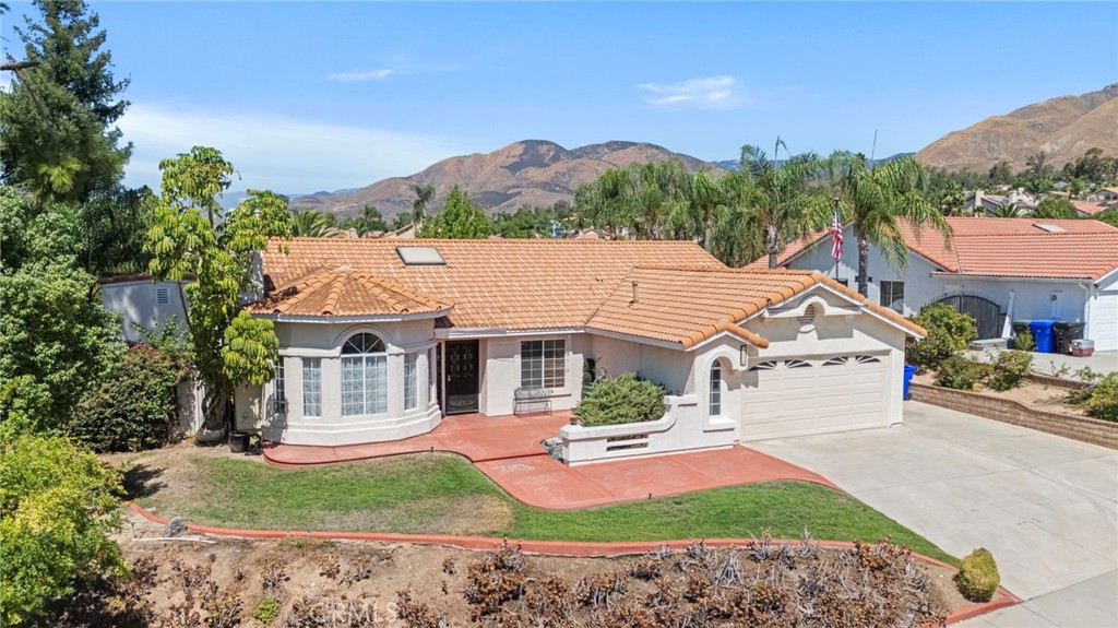Welcome to 7126 Ridge Drive, a beautifully maintained Highland home with thoughtful upgrades throughout. Tucked away on a quiet cul-de-sac, this property offers both privacy and a true neighborhood feel. From the moment you arrive, you’ll love the inviting front courtyard with its cozy seating area, perfect for coffee or quiet relaxation. Step inside to a flexible layout that offers both comfort and function.
Just off the entry is a versatile bedroom and office combination that works equally well as a home workspace, guest room, or playroom. To the left, the open living and dining rooms feature upgraded flooring and large windows that frame beautiful exterior views, while vaulted ceilings with a skylight fill the home with natural light. At the heart of the home, the kitchen connects seamlessly to a second living area, anchored by a dual-sided fireplace that creates a warm and inviting atmosphere for casual gatherings.
Down the hallway, you’ll find a convenient half bathroom, a storage closet, and a laundry room with direct garage access. Two additional bedrooms are joined by a Jack-and-Jill full bathroom with a tub and shower, each bedroom offering mirrored closets and plenty of space. The primary suite is a private retreat with dual closets, direct access to the backyard, and a spa-like bathroom complete with a soaking tub, walk-in shower, dual vanities, and a private water closet.
The backyard is designed for both entertaining and everyday living, with a spacious covered patio and barbecue area that flow into a wide-open yard. With no neighbors directly behind, the space feels private and serene, and the lot even extends beyond the rear fence line. In the evenings, you’ll love the breathtaking sunsets that paint the sky, making this backyard the perfect setting to relax, host friends, or simply unwind after a long day. On the side of the home, two well-kept storage sheds provide even more space for tools, equipment, or seasonal items, keeping everything organized and out of sight.
Additional features include a two-car garage with extensive rafter storage, a new furnace and air conditioning system, and a water heater installed in 2017.
This home combines flexibility, comfort, and modern upgrades, all set in a peaceful cul-de-sac location that enhances both safety and tranquility.