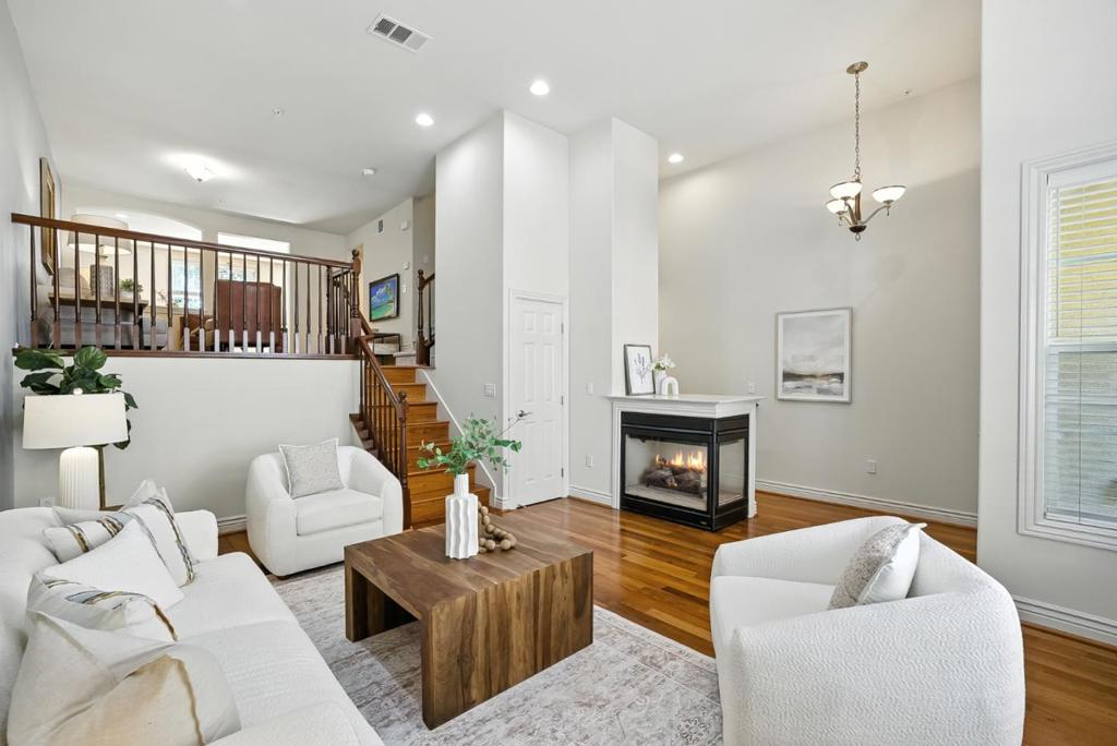 Welcome home to this award winning Toll Brothers construction townhome in the heart of Sunnyvale, minutes from the newly built Downtown Sunnyvale. Endless Toll Brothers upgrades such as elegant exterior facade, crown & window molding, 8' doors, upgraded baseboards, top notch quality construction and more! Glowing hardwood floors, recessed lighting, new plush carpets on upper level and freshly painted! Open Living Room w/14' ceilings, loads of natural light that shine in from the floor to ceiling windows and 2 sided gas fireplace! Separate Living Area that overlooks the Formal Living Room, allowing you to easily entertain large groups. Dining Room adjoins the Kitchen w/stainless steel appliances, granite counter, a window over the sink and ample cabinet space. Powder Room off of the Dining Rm. Oversized Owners suite w/a luxurious tray ceiling, WIC, dual sinks, fully tiled shower. Spacious 2nd & 3rd bedrooms can also be found on the upper level w/a full hallway bathroom. Laundry area is conveniently located on upper level. Centrally located near major parks, CalTrain, Downtown Sunnyvale & more! Loads of dining, Whole Foods, Target and entertainment in the newly built Downtown Sunnyvale! Easy commute to both Apple Campuses, Google, Nvidia, Amazon & more! Don't miss out!