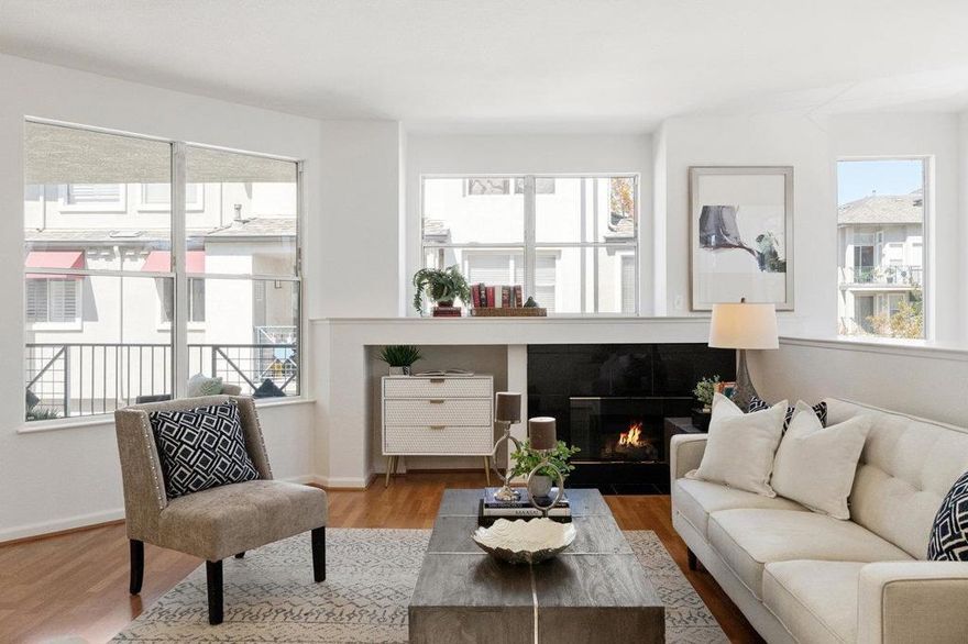 Amazing NEW PRICE!  END UNIT townhome offers a bright open-living floorplan.  Located just steps from the estuary, this means you will be treated to amazing waterviews.  This is a sought after end-unit, 2 bed, 2.5 bath townhome has high ceilings and lots of natural light:  Direct inside access to a 1 car garage. 2nd assigned parking space is right out the front door.  Living / Dining room has a gas fireplace and a spacious balcony, convenient main-level updated Half-Bath.  Kitchen: New Quartz counters, stainless steel sink, fixtures, painted cabinets and new pulls. Primary Bedroom suite has walk-in closet and updated bath with Quartz counters, painted vanity and new water fixtures  EXTRAS: New Light fixtures, New carpets in stairway, hallway and 2 bedrooms: In-unit Laundry: New interior paint: Baths have new vanity quartz countertops/sinks and fixtures.  The complex has a sparkling pool, community center, with gym, and nearby Shannon Park, that provides a playground and picnic areas...Its like having a big backyard!  HOA covers Clubhouse, pool, spa, gym, water, garbage, common area maintenance, landscaping/common area insurance. INCLUDES RSOA fee yearly membership fee too :)