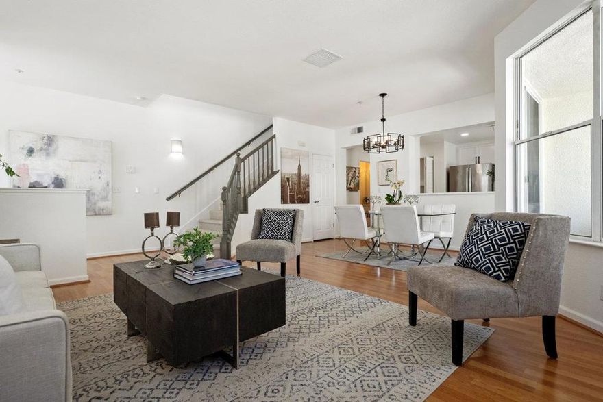 Amazing NEW PRICE!  END UNIT townhome offers a bright open-living floorplan.  Located just steps from the estuary, this means you will be treated to amazing waterviews.  This is a sought after end-unit, 2 bed, 2.5 bath townhome has high ceilings and lots of natural light:  Direct inside access to a 1 car garage. 2nd assigned parking space is right out the front door.  Living / Dining room has a gas fireplace and a spacious balcony, convenient main-level updated Half-Bath.  Kitchen: New Quartz counters, stainless steel sink, fixtures, painted cabinets and new pulls. Primary Bedroom suite has walk-in closet and updated bath with Quartz counters, painted vanity and new water fixtures  EXTRAS: New Light fixtures, New carpets in stairway, hallway and 2 bedrooms: In-unit Laundry: New interior paint: Baths have new vanity quartz countertops/sinks and fixtures.  The complex has a sparkling pool, community center, with gym, and nearby Shannon Park, that provides a playground and picnic areas...Its like having a big backyard!  HOA covers Clubhouse, pool, spa, gym, water, garbage, common area maintenance, landscaping/common area insurance. INCLUDES RSOA fee yearly membership fee too :)