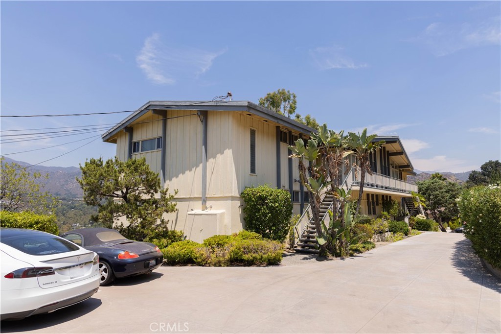 Welcome to 1860 Verdugo Loma Drive, a rare fourplex investment opportunity located in the prime North Glendale area. Situated on a generous 26,000+ square foot lot, this asset offers a total of 5,198 square feet of living space, with each spacious unit measuring 1,299.5 square feet. Each unit features two bedrooms and two bathrooms, delivering a comfortable and functional layout.
Built with mid-century charm, the property retains original architectural features visible both inside and out, including accent walls and fireplaces in the living areas. While all units currently share a common laundry room, they do not have washer/dryer inside. Each unit has a one-car covered garage and one open parking space.
Currently, two units on the lower level are available for rent, while the two upstairs units are occupied at below-market rents of $1,400 and $1,600 monthly. Notably, one tenant has been in residence for 30 years, and another for over 10 years, providing a stable rental history.
Photos shared in this listing showcase Unit A, which is somewhat dated but in excellent condition, and Unit B, which is well-maintained but shows more signs of age. Units C and D are in a different condition and are not featured in the photos at this time. We kindly request that prospective buyers respect the privacy of current tenants and refrain from contacting them directly.
Though the property has solid structural bones, it does require deferred maintenance and updates. These conditions are subject to buyer’s inspection and verification. However, the property will be sold as-is, with no credit to be provided.
With its excellent location, generous lot size, charming character, and significant upside potential through renovation, this fourplex represents a compelling opportunity for investors seeking to add value in a highly desirable Glendale neighborhood.