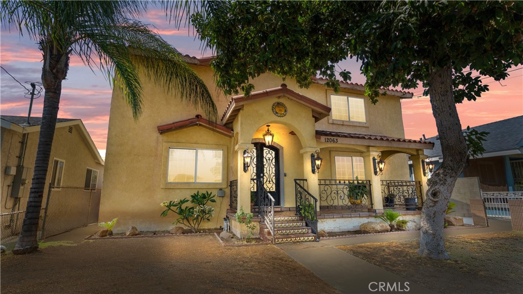 LOCATION! LOCATION! LOCATION! Welcome to this stunning Spanish-style two-story residence, ideally situated on the border of Downey and Norwalk—a prime location for both lifestyle and investment. Rebuilt from the ground up in 2005, this property offers modern construction with timeless character, including a permitted 1 bed/1 bath guest suite. The main home features 4 bedrooms, 3 bathrooms, and an additional flex space that can be used as an office, nursery, or bonus room. Enjoy unbeatable convenience—just 3–6 minutes from BMW, AUDI and Porsche dealerships, Target, Golf N' Stuff, Stonewood Center, Target, Costco, local parks, and top-rated schools. This is a commuter’s dream, offering quick access to Interstates 5, 605, and 105, connecting you to Los Angeles, Orange County, LAX, and beyond. Per County Assessor, property is noted as a duplex; however, City permits reflect a two-story main residence and a detached guest room. Buyers are advised to conduct their own investigations with the City of Norwalk to confirm current use and zoning compliance. Guest quarters are currently occupied but tenant will vacate by close of escrow.