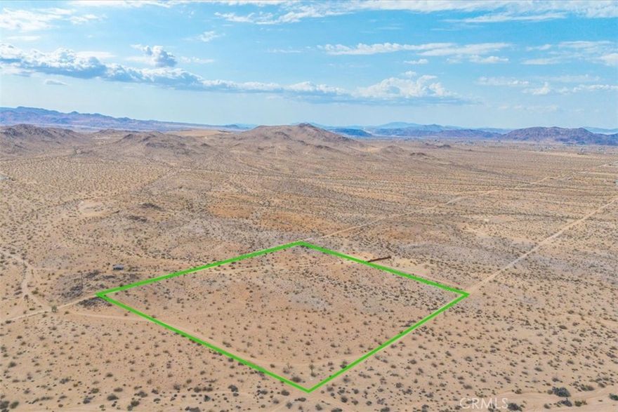 Set in one of the most sought-after pockets of North Joshua Tree, this rare 10-acre parcel offers the ideal canvas for your dream desert home. With city water connection eligibility and Edison power already on the southwest corner, utilities are within easy reach. The land features a mix of gentle rolling hills and flat buildable pads, allowing for flexible architectural possibilities and seamless integration with the landscape. Take in uninterrupted 360° views of the desert, surrounding mountains, and stunning sunrises and sunsets. Whether you're building a personal retreat or future investment, this parcel is perfectly priced and primed for development. Opportunities like this in Joshua Tree’s high-demand areas are increasingly rare—don't miss your chance to claim your own piece of the desert.