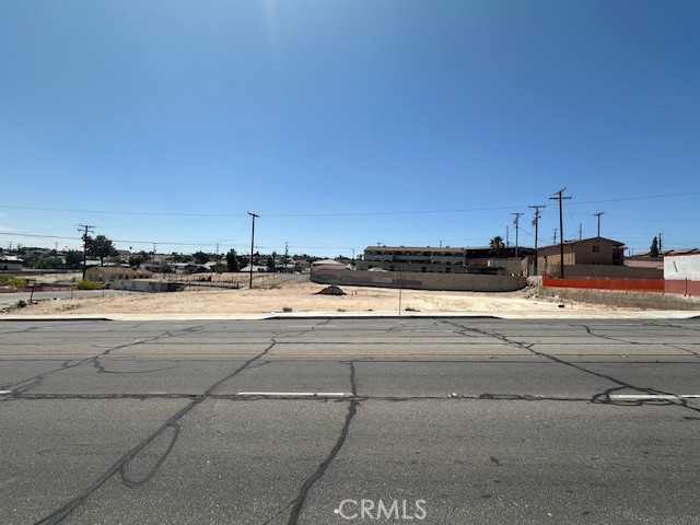 Commercial lot 18,434 sf fronting paved Main Street, Barstow. Utilities on the street (buyer to verify). APN # 0181-091-05-0000. Ideal for development. Close to other businesses, apartments, etc.