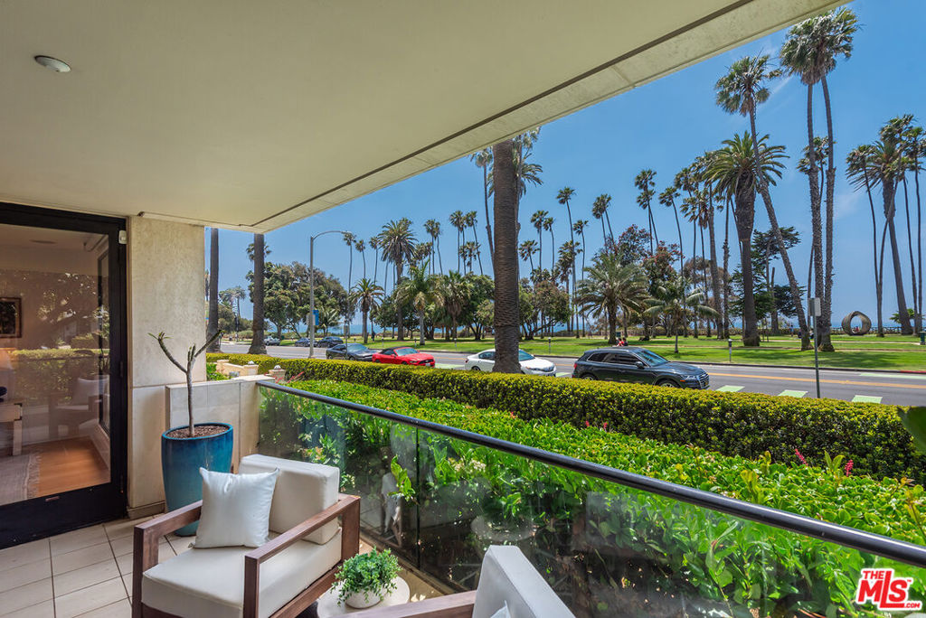 Experience coastal living at its finest in this elegant, single level residence set within the newer, boutique style 701 Ocean Avenue. Perfectly positioned on the coveted northwest corner, this premium unit is bathed in natural light from expansive floor to ceiling windows that frame lush park scenery, vibrant greenery, and the endless blue of the Pacific. Indoors, a harmonious blend of bamboo and marble flooring establishes a warm yet sophisticated ambience, complemented by custom contemporary window coverings. The open layout flows effortlessly to a spacious outdoor patio accessible from both the living room and the primary bedroom creating a seamless indoor outdoor lifestyle ideal for relaxing or entertaining. The generously sized primary suite is a tranquil retreat featuring a walk in closet plus additional storage, along with a spa inspired bath boasting a double vanity, jetted tub, and steam shower. Residents enjoy a secure, concierge building with gym, meeting space with catering kitchen, side-by-side parking, extra storage, and a soon to be completed world class rooftop deck, perfectly timed for late summer enjoyment. Beyond your front door, you're just a stone's throw from the boutiques, cafes, and acclaimed restaurants lining nearby Montana Avenue, placing the best of Santa Monica's dining and shopping scene at your fingertips. This is a rare opportunity to claim a refined coastal sanctuary in one of Southern California's most desirable oceanfront settings.