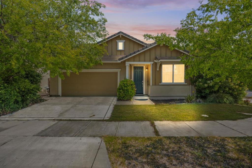 Welcome to this inviting home listed by Kevin Jacob; located on a large corner lot in the highly sought after Edgewater community within the vibrant River Island area. Spanning 1,841 sq ft, this residence boasts three bedrooms and three full bathrooms, offering ample space for comfort and functionality. The kitchen is a chef's delight, equipped with modern appliances including a gas oven range, microwave, dishwasher, and garbage disposal. High ceilings enhance the spacious feel throughout the home. The separate family room features a cozy fireplace, perfect for relaxing evenings. Flooring is beautifully laid out, complementing the home's warm atmosphere. Stay comfortable year-round with central AC and heating. Laundry is conveniently located inside, with multiple hookup options available. School-aged children will be part of the Banta Elementary School District, reputable charter schools, & River Island Highschool. Additional amenities include community facilities, an electric vehicle hookup level 2 (240 volts), and energy-efficient features such as fully owned solar power and insulated walls. The home also includes a two-car garage for storage and parking needs. Walking distance from the breathtaking Michael Vega Park