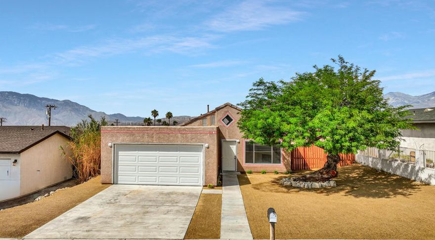 Step into this beautifully remodeled home located in a well-established neighborhood of Desert Hot Springs A masterful renovation brings out the best with modern finishings, offering today's homeowner a practical and inviting floor plan with modern conveniences and charm. Step inside to a functional, open layout with a natural flow from room to room. The living area enjoys easy connectivity to the kitchen, making entertaining and day-to-day living seamless. The remodel showcases sleek, luxury vinyl plank flooring throughout, high vaulted ceilings, new lighting and ceiling fan fixtures, and decorative gas fireplace. The brand new kitchen is a chef's dream, complete with stainless steel appliances, custom cabinetry, and quartz countertops with a peninsula bar for casual dining. The spacious master suite opens to a patio with amazing panoramic mountain views. Whether you're relaxing indoors, stargazing from the patio, or exploring nearby shops and restaurants, this home offers the ultimate desert lifestyle.