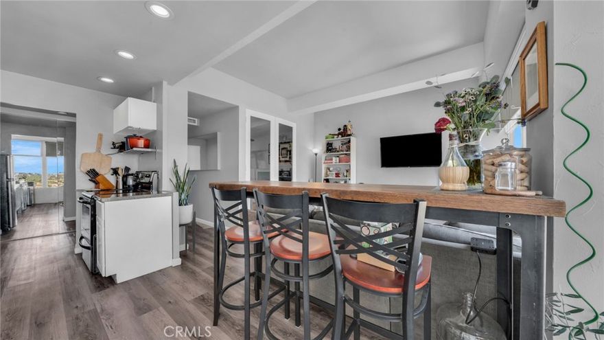 Experience the epitome of beach and urban living with this coveted 9th-floor CITY LIGHTS VIEW residence at the iconic Royal Palms! Nearly 500 sq ft of remodeled space which includes vinyl flooring & smart recessed lighting.  This studio unit has been modified to include a separate bedroom space opening to the living room with double French doors.  From the living room, enjoy mountain and city light views!  The adjoining remodeled chic kitchen features quartz counters, contemporary footed cabinetry, stainless appliances, recessed lights, fridge and stainless drawers & shelving! Upgraded cabinetry in bath along with wand shower head and upgraded fixtures.  Built-ins added inside the mirrored closet, plus extra storage in garage area.  Royal Palms is a pet-friendly building; and your HOA includes hot & cold water, trash (and trash chute), heat, Amazon drop station, community pool, meeting room, security patrol and on-site management - plus coming-soon rooftop entertainment! You are in the heart of fabulous Restaurants, Shops, Art Galleries, the Performing Arts Center, the Metro, Shoreline Village - AND a hop and skip from the beach! Enjoy the monthly street fairs, art walks, annual Grand Prix and much more!