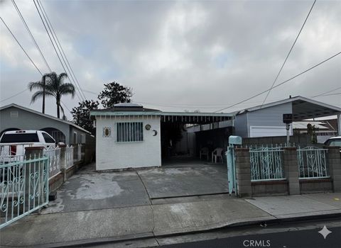 Photo of 8217 Howe St, Paramount, CA 90723 (MLS # RS26001855)