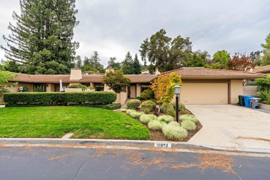 Welcome to 10893 Canyon Vista Drive, this single level home spanning 2 bedrooms, 2 bathrooms, and 1,973 of living space. Nestled among lush greenery with stunning mountain views. A large kitchen that includes granite countertops, spacious kitchen island and stainless steel Thermador appliances. Enjoy recessed lighting and hardwood flooring throughout, a private patio, a cozy living area with a gas fireplace and 2 car garage. A spacious primary bedroom with brand new carpet, double walk-in closets and a large bath with a double sink and jacuzzi. Residents enjoy a gated community with access to resort-style amenities such as a pool area, recreation center, gym and tennis courts, all within the top-rated Cupertino school district.