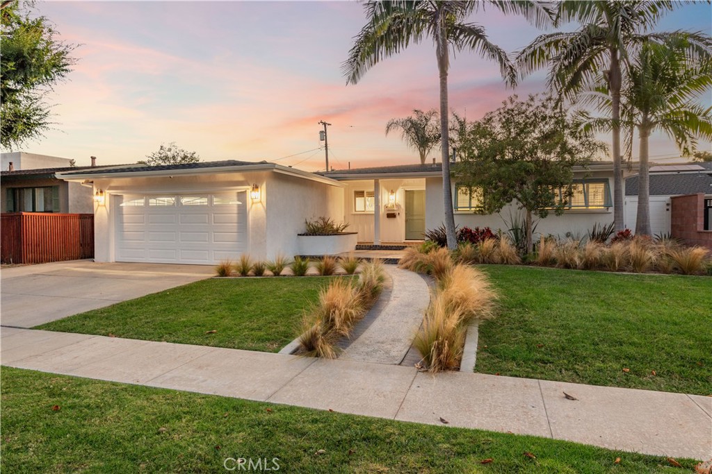 Experience the elegance of island-inspired design and model home perfection at 1841 Tevis Ave—where Bahamian charm meets luxury in one of Long Beach’s most desirable neighborhoods. This move-in ready residence has been extensively upgraded with the finest finishes and thoughtful design details. From the moment you arrive, the beautifully landscaped front yard and charming curb appeal set the tone for what awaits inside. You'll smile as you enter through the Dutch door entry into the open-concept living space where natural light highlights designer touches throughout. At the heart of the home is the dream kitchen—a true showcase featuring double dishwasher drawers, a built-in SubZero refrigerator, Wolf range, an expansive island with gorgeous beveled quartz countertops, and a refined Farrow & Ball paint palette that elevates every detail. Perfect for both everyday living and having friends and family over, this kitchen flows effortlessly into the dining and living areas. The spacious bedrooms and upgraded bathrooms continue the theme of luxury. Extra large ensuite primary bedroom with walk in closet, door to backyard, and beautiful backyard views. The primary bathroom is absolutely gorgeous with quartz countertops, dual sinks, large walk in shower, vanity area, and the most beautiful tile design. The floor plan is smart and thoughtful with two additional spacious bedrooms and upgraded bathroom located in the opposite wing of the home. Additional noteworthy features include newer HVAC added in 2018, dimmable Lutron lighting, high-end ceiling fans, and solid core doors (additional upgrades are attached in the Supplement Section). Enjoy indoor/outdoor living with the gorgeous backyard expertly designed with newer hardscape and landscape featuring multiple patio spaces, outdoor shower, and large grassy area. The finished two-car garage, complete with air conditioning and three TVs, offers versatility as a home gym, creative studio, or home office. Located in one of Long Beach’s most desirable neighborhoods, this home is just a short stroll to Minnie Gant Elementary and minutes from CSULB, Alamitos Bay, wonderful parks, shopping, and dining. This stunning home offers the ideal setting for family life and lifestyle—beautifully upgraded, a great neighborhood, and a home filled with spaces made to gather and grow.