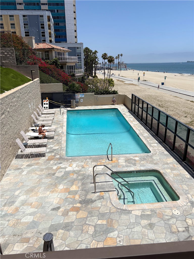 **Coastal Living with Ocean Breeze – 2 Bed, 2 Bath Condo on Ocean Blvd**
Welcome to 1750 E Ocean Blvd, Unit 201 – Enjoy the benefits of beach access, swimming pool/hot tub overlooking the ocean, community room and fitness center, just steps from the sand. Inside the unit, a beautifully remodeled 2-bedroom, 2-bathroom condo in the heart of Long Beach’s vibrant coastal scene near Alamitos Beach and Bluff Park. This spacious and updated unit features a light-filled open layout, in-unit laundry, and a peekaboo view of the ocean, perfect for enjoying coastal sunsets from the comfort of your home.
Both bedrooms offer generous space and modern finishes, while the updated kitchen and bathrooms bring comfort and style. Enjoy the convenience of secure parking and everything Long Beach has to offer just steps from your door — from the beach and bike paths to top-rated restaurants, shops, and cultural attractions.
Live where others vacation!