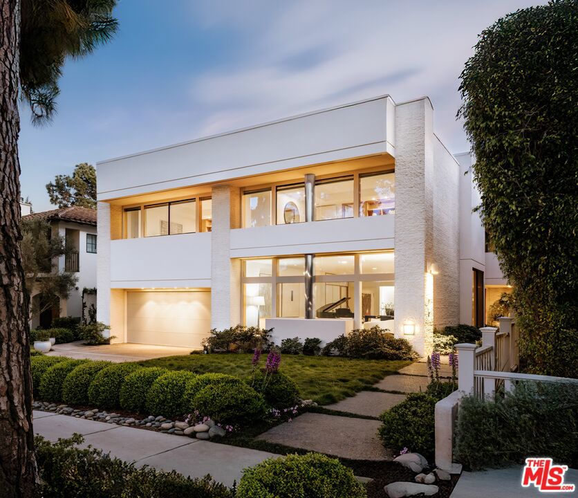 Set on a coveted 60 ft wide, 8,715 sqft lot in Santa Monica's prized Gillette Regent Square, just north of Montana Avenue, 622 24th Street is a rare Bauhaus gem offering 8,350 sqft of refined living. Designed by world-renowned architect Irving Tobocman--his only residential project in California--this striking contemporary home exemplifies proportion, materiality, and natural light at its finest. A harmonious blend of form and function, the residence features full-slab Italian travertine floors, custom-crafted oak millwork, and floor-to-ceiling glass, reflecting Tobocman's commitment to continuity, spatial harmony and timeless design. The main level opens through a gracious formal foyer into a voluminous living room and a defined dining space, framed by floor-to-ceiling glass windows which blend the indoors with the natural landscape. A sleek chef's kitchen with dual Sub-Zero refrigerators, Gaggenau ovens, and a Wolf range anchors the home, complete with an oversized island, breakfast nook, and walk-in pantry. The adjacent family room is ideal for entertaining, featuring a travertine bar, built-in Sonos system, and sliding walls of glass that open to a lush, newly renovated backyard with a saltwater pool, spa, and baja. A bedroom, two powder rooms, and an attached two-car garage complete the main floor. A dramatic double-height corridor with architectural glass block leads upstairs to four spacious bedrooms all with en-suite baths, oversized walk-in closets, and custom built-ins surrounding a cozy, sunken den. The primary suite is a true retreat with dual baths, a jacuzzi-jet soaking tub, massive walk-in closet, and a 35 ft private terrace overlooking the pool. Descending downstairs, the lower level boasts a sprawling recreation room perfect for entertaining guests, children to play and health and wellness programming. A new custom kitchenette, private office, laundry room, 371 sqft of storage, and a full guest suite with private living room, bedroom, and full bath. Located just minutes from the Brentwood Country Mart, Franklin Elementary, and the boutiques and cafes of Montana Avenue, 622 24th St is an irreplicable one-of-a-kind architectural statement, an art collector's dream, and a true sanctuary for modern family life.