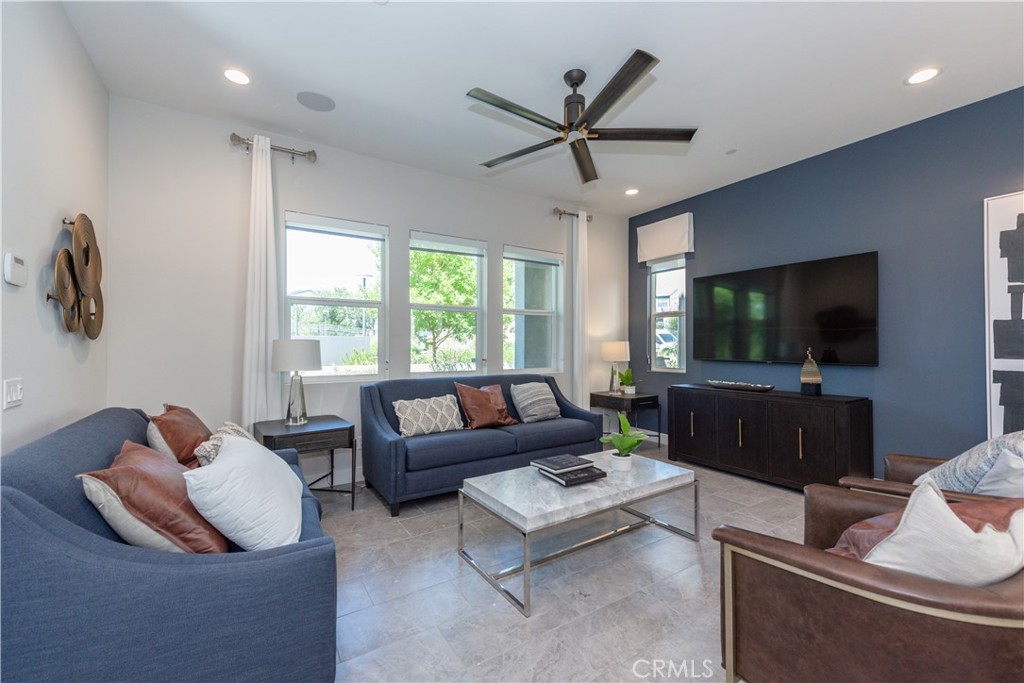 FORMER Rise MODEL HOME with furniture and endless upgrades! This new construction sprawling 3B/2.5B home with balcony capturing views of Rise Park which includes built-in BBQ, playground, firepits, and covered deck large enough to host large gatherings with sunset views. Large front patio with tiled flooring and fountains. Vaulted Ceiling entrance to the wide-open great room. Private California room with tri-panel sliders off of the kitchen. Executive Island in Kitchen with Double oven, 36-inch built-in range chef’s cook top. Private loft on the second level tucked between the master suite and guest bedrooms. Free Standing bathtub next to the glass-enclosed shower. Double walk in closets in the master suite. Wrap around balcony with view, conveniently located right off of master bedroom. Oversized laundry room with sink and storage closet. Enjoy all the amazing amenities of the Great Park Neighborhoods, including its clubhouse, heated pools, hot tubs, sports courts and fields, playgrounds, and picnic areas. Walking distance to Portola High School.