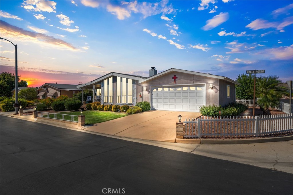 Welcome to this charming CORNER LOT home in the private Golf Knolls 55+ community, where you actually OWN YOUR LAND. Inside, you’ll love the spacious layout with soaring wood beam cathedral ceilings, a cozy gas fireplace, and a kitchen with stone countertops and a custom backsplash.
The home offers two large bedrooms, an over-sized walk-in closet, tons of storage, and a 2-car enclosed garage with plenty of room for everything you need. Step out to the covered front or back porch and enjoy the peacefulness of this quiet neighborhood. This home was also thoughtfully designed with LOW-MAINTENANCE landscaping that enhances the curb appeal. Community amenities include a pool, spa, exercise facility and clubhouse. This property also has LOW TAXES & LOW HOA.
Best of all? This home QUALIFIES FOR ALL LOAN TYPES, making it easy to call it yours. Schedule your private showing today!
