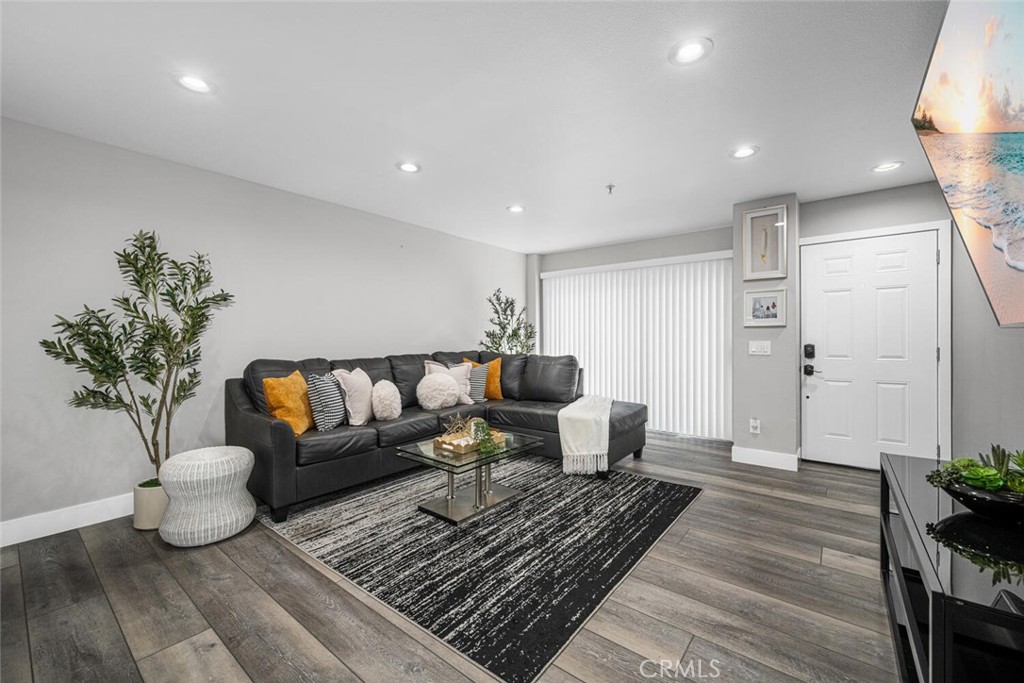 Get more bang for your buck with this move-in ready gem in one of Carson’s most convenient locations. Welcome to this beautifully updated stylish 3 bedroom, 3 bath two-level condo located in a quiet, secured gated community. Thoughtfully remodeled just 1 year ago, this home offers the perfect blend of modern updates, comfort, convenience and value for today’s lifestyle. The bright, open floor plan features luxury vinyl flooring, fresh interior paint, recessed lighting, and a spacious living area that flows seamlessly into the dining space and open kitchen.
The kitchen comes complete with newer appliances, making it as functional as it is inviting including a mini bar by the staircase and extra storage under the stairs and inside laundry for added practicality. Additional features include: Enjoy year-round comfort with a newly installed Lennox heating and cooling system paired with a smart Nest thermostat. Step outside to two cozy private patios, one off the living room and another off the downstairs bedroom, both with sliding doors for easy indoor-outdoor flow ideal for relaxing. Upstairs, retreat to two en suite bedrooms, including a serene, generously sized primary suite featuring a remodeled dual-sink bathroom designed with a spa-like feel. Smart mirrors throughout add a touch of modern convenience. Two side-by-side deeded parking spots in a gated subterranean garage. Low HOA dues for added savings. Pet-friendly community. Perfectly located just minutes from Carson Shopping Center, Civic Center, local parks and Dignity Health Sports Park (home of the LA Galaxy) Easy access to the 405 freeway puts you only 20 minutes from Downtown LA. This condo is a rare find at an incredible value!