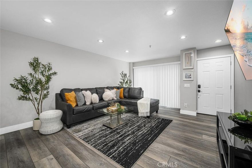 Get more bang for your buck with this move-in ready gem in one of Carson’s most convenient locations. Welcome to this beautifully updated stylish 3 bedroom, 3 bath two-level condo located in a quiet, secured gated community. Thoughtfully remodeled just 1 year ago, this home offers the perfect blend of modern updates, comfort, convenience and value for today’s lifestyle. The bright, open floor plan features luxury vinyl flooring, fresh interior paint, recessed lighting, and a spacious living area that flows seamlessly into the dining space and open kitchen. 

The kitchen comes complete with newer appliances, making it as functional as it is inviting including a mini bar by the staircase and extra storage under the stairs and inside laundry for added practicality. Additional features include: Enjoy year-round comfort with a newly installed Lennox heating and cooling system paired with a smart Nest thermostat. Step outside to two cozy private patios, one off the living room and another off the downstairs bedroom, both with sliding doors for easy indoor-outdoor flow ideal for relaxing. Upstairs, retreat to two en suite bedrooms, including a serene, generously sized primary suite featuring a remodeled dual-sink bathroom designed with a spa-like feel. Smart mirrors throughout add a touch of modern convenience. Two side-by-side deeded parking spots in a gated subterranean garage. Low HOA dues for added savings. Pet-friendly community. Perfectly located just minutes from Carson Shopping Center, Civic Center, local parks and Dignity Health Sports Park (home of the LA Galaxy) Easy access to the 405 freeway puts you only 20 minutes from Downtown LA. This condo is a rare find at an incredible value!