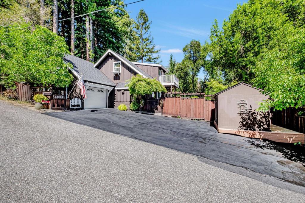 BEAUTIFUL HOME WALK TO TOWN. This is a Gorgeous Chalet Style Home and has an Exquisite Layout and Fabulous yard. Spacious Open Floor Plan Combo Kitchen Living and Dining Room Areas. You will love the warm home feeling looking out the Bay Window at the Fountain in the yard. There is a Pizza Oven and Pagoda to enjoy entertaining with Family and Friends. You wont want to miss this AMAZING PROPERTY. Plenty of Parking and has an attached garage.