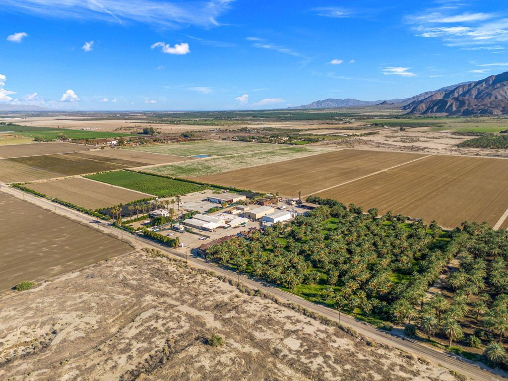 $250,000 Price Reduction! The Firm Brokerage is pleased to present a remarkable 34,655 SF Date Processing Facility sitting on 11.42 Acres in Thermal. This expansive property includes over 18,000 SF of versatile warehouse space (which includes approximately $1M worth of date processing equipment - inquire for inventory list), 10,000 SF of cold storage, over 2,000 SF of private office space, along with dying rooms, steam rooms, and more. Additionally, there are three single family homes on-site, two of which are rented on month-to-month terms. Encompassing the remainder of this property is over 7.5 Acres of Medjool date trees ranging from 3-20 ft tall, which annually produce approximately 25,000 pounds of fruit. This facility was annually processing around 4.5 million pounds of dates per year, and was designed to handle up to 6 million pounds per year. Propane and natural gas are readily available, along with IID Power which offers the cheapest electricity in the valley. This property is situated within the opportunity zone, allowing for a number of advantageous tax incentives. Whether you continue the use of this property as a date packing facility with all of the infrastructure, equipment, and trees ready to go, or operate under a different use, this property is configured to effectively handle a wide range of businesses and uses. This zoning also allows for cannabis uses including cultivation, manufacturing, distribution, and more.
