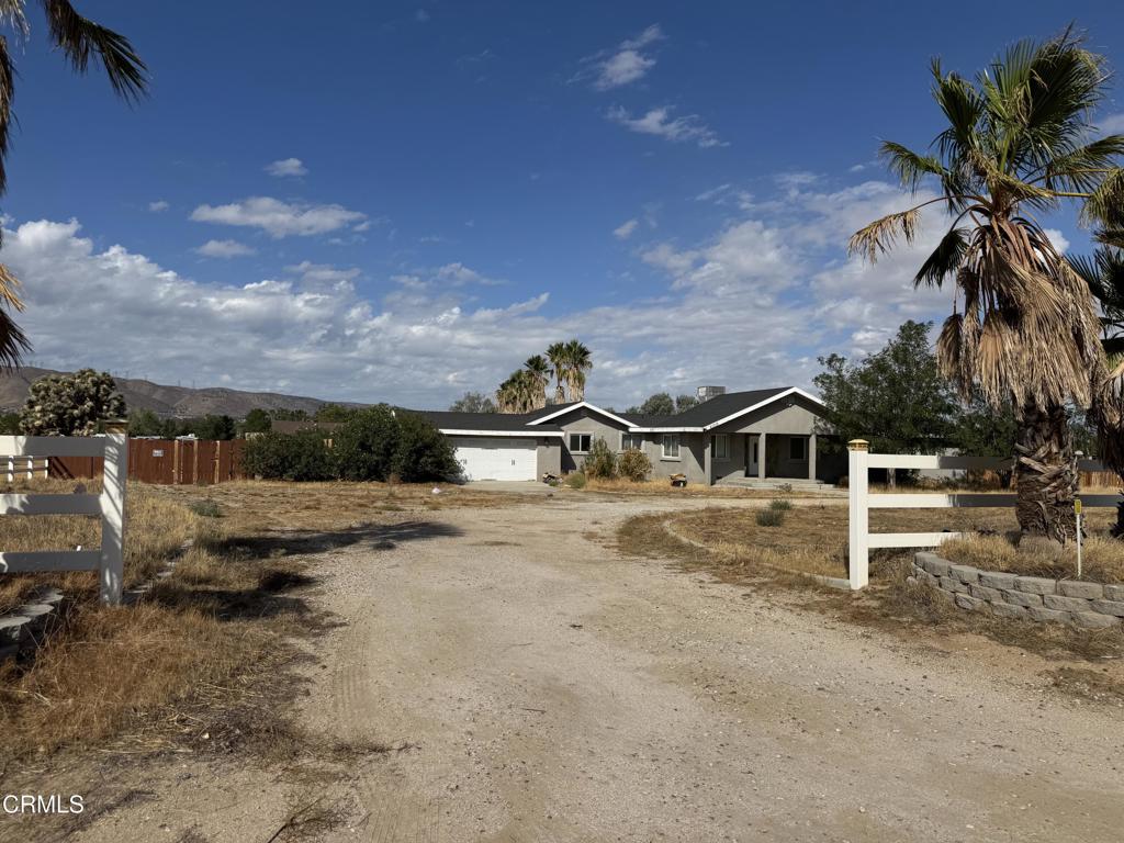 Incredible Custom Home Located in Sunnyside Farm Mutual Water Company area. This Private Built Estate Offers an Open Floor Plan with an Oversized Workshop 20x50 on 3 Acres, PLUS an Attached 2 Car Garage. Home Features a Spacious Floor, NEW Paint, NEW Flooring, Completely REMODELED from Top to Bottom. This Beautiful Home Features 3 Bedrooms & 2 Bathrooms, a Grand Entrance to the Living Room, Dining Room, and a Beautiful Stone Fireplace. Vinyl Hardwood Flooring Through Out, NEW Kitchen w/ a Large Island, Dining Area, Granite Counter Tops, NEW SS Appliances, Large Pantry, NEW Self Closing Drawers and Cabinets. Large Family Room, NEW Windows, NEW Vanities in the Bathrooms, Master Bathroom Features Custom Tile Shower, NEW Vanity, Heavy Glass Doors, LARGE Walk in Closet.