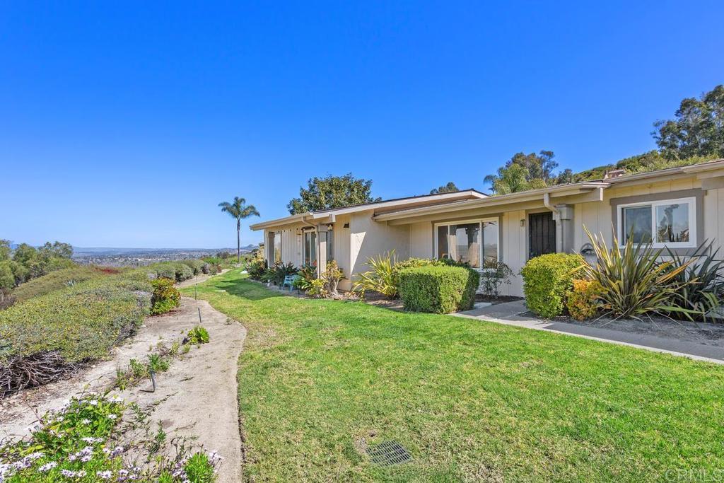 ** REMODELED OCT 2025!** This beautifully updated single-story 2-bedroom, 2-bath home sits high above the San Luis Rey Valley, offering gorgeous panoramic views and refreshing coastal breezes. Located in the desirable 55+ Oceana Mission I community, this hilltop retreat will captivate your heart! Enjoy freshly updated finishes including new paint, new carpet, new baseboards, new fixtures, new stainless steel appliances, and new quartz countertops. A new roof was installed Fall 2024. The interior showcases warm terra cotta color tile floors, dual-pane Milgard vinyl windows and smooth ceilings. A termite clearance was completed in April 2025, giving peace of mind for years to come. The inviting layout includes a private back patio which is ideal for gardening, relaxing, or outdoor dining. The patio connects to the 1-car garage with washer and dryer included. Residents love the vibrant Oceana Mission I lifestyle, offering a clubhouse, gym, pool, spa, and beautifully maintained walking paths surrounded by lush landscaping. Water, sewer, trash, and cable TV are all included in the HOA. Conveniently located less than a mile from shopping and dining, and just minutes to Oceanside Harbor, local beaches, and easy freeway access. With its fresh updates, stunning views, and unbeatable location, this charming home is truly a must-see!