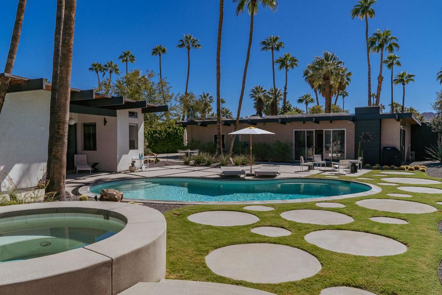 Midcentury architectural gem on an oversized lot with large casita! Located in the sought after midcentury neighborhood of Sunmor, surrounded by highly designed midcentury properties. A very private enclave perfect for walking and biking, but also minutes from downtown. Five bedrooms in total, one serving as the perfect home office, three in the main house, and one in the casita, which also features a full kitchen! Beautifully updated to showcase classic midcentury details -- post and beam construction, floor to ceiling plate glass, warm organic tongue and groove ceilings. Exceptionally large main entertaining space for a house of this style. Lush, mature landscaping, with a recently updated pool and hardscape. Backyard is fully walled and driveway features a motorized gate for privacy. 35 panels (8.575 kW) of fully owned solar. The street presence is iconic, and the pedigree is purely Palm Springs.