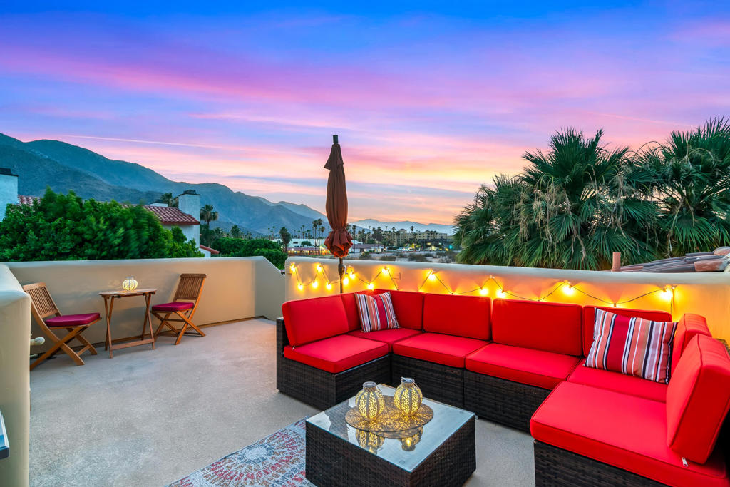 Welcome to Villorrio, a luxurious enclave of Tuscan inspired homes in a resort-style gated community, located just a few blocks from the Heart of Palm Springs. Prepare to be WOWED by this highly upgraded townhome perfectly situated in the best location in the community, offering stunning mountain views! With upgrades galore, this spacious two-bedroom, two-bathroom home has been beautifully updated for a modern feel. The lower level offers a junior primary ensuite with an updated bathroom, complete with quartz countertops and stylish art deco tile. With a nice separation between bedrooms, guests will enjoy their own private living space along with their own private outdoor patio. As you enter the second level, you are welcomed by an open kitchen and living area, drenched with natural light and spectacular mountain views. The primary suite has also been remodeled with a spa-like bathroom and large walk-in closet. Not to be missed is the rooftop deck with panoramic mountain views, the perfect place to catch beautiful sunsets and enjoy the best of Desert Living. Community amenities are equally impressive including a large pool, three spas, fitness center, clubhouse, community BBQ, cobblestone driveways, and beautiful fountains. This unique home is perfect as a primary residence, second home, or lucrative vacation rental.