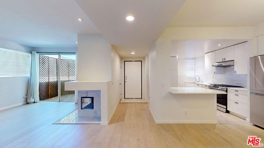 Perfectly situated in the heart of Encino, this beautiful condo offers unbeatable convenience just minutes from Ventura Boulevard's vibrant restaurants, cafes, and shops. Commuting is a breeze with easy access to the 101 and 405 Freeways, while nearby parks and golf courses provide plenty of opportunities to enjoy the outdoors. This unit combines modern updates with timeless comfort, an ideal place to call home!FEATURES: 2-Bedrooms + 2-Bathrooms. Approx. 1,200 sq. ft. of living space. Bright, open-concept floor plan with soaring ceilings. Two spacious bedrooms, including a primary suite with a separate shower and jacuzzi tub. Beautiful hardwood floors throughout the unit. Modern kitchen with stainless steel electric stove, dishwasher, disposal, refrigerator, a built-in microwave, and abundant cabinet and shelf space. Recessed lighting throughout. Two inviting fireplaces that add warmth and character. Two private balconies/patio areas perfect for relaxing or entertaining. Central air conditioning, heating, and ceiling fans for year-round comfort. Oversized closets provide plenty of storage. In-unit washer and dryer for ultimate convenience. Updated guest bathroom with contemporary finishes. Elevator access in a secure, well-maintained building. Two assigned parking spaces in a gated garage, plus ample guest parking. Water, trash and gardening services included. One dog or one cat is permitted, up to 25 lbs. (subject to approval).Monthly pet support fee from $75 - $125 (depending on Petscreening rating).