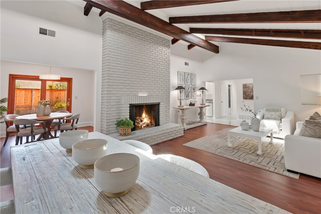 Experience the perfect blend of timeless design and effortless living in this sun-filled single-level home, nestled within the highly desirable La Jolla Scenic Heights community.
Upon arrival, a warm entry leads into a radiant Great Room, where impressive beamed ceilings and abundant natural light frame a timeless fireplace, capturing the perfect balance of sophistication and serenity. At the heart of the home, the chef’s kitchen shines with quartz countertops, stainless steel appliances, tailored cabinetry, and custom sliding glass doors that invite both cozy gatherings and lively celebrations all year long.
Spanning 1,876 sq. ft. of living space, this residence features four generously sized bedrooms, two beautifully updated bathrooms, and a fifth versatile bonus room—ideal as a home office, creative studio, or play area. The primary suite serves as a peaceful retreat with its own en-suite bath and ample closet space.
Set on a rare 8,000 sq. ft. lot, this versatile property is designed for both comfort and opportunity. Outdoor living is enhanced by a gated courtyard, multiple patios, and low-maintenance new landscaping, creating a natural extension of the home’s living space. Additional features include a two-car garage with built-in cabinetry, a spacious driveway, and a hallway lined with storage—maximizing every square foot with thoughtful design. Whether for growing families, multi-generational living, or those seeking added value, this **premium lot** provides **exceptional ADU potential** and room for expansion (garage conversion and/or secondary ADU unit).
To top it off, this serene abode comes with NO HOA fees and is located just minutes from UC San Diego, Torrey Pines Elementary, Whole Foods, Trader Joe’s, YMCA, synagogues, UCSD Jacobs Medical Center, and La Jolla Shores beaches.Enjoy proximity to renowned dining, vibrant shopping centers, and quick freeway access—delivering the ultimate blend of convenience and lifestyle.
Welcome to 8924 La Jolla Scenic Dr. North, where coastal charm meets modern sophistication in one of La Jolla’s most sought-after neighborhoods. A rare opportunity to preview and make this refined gem your own!