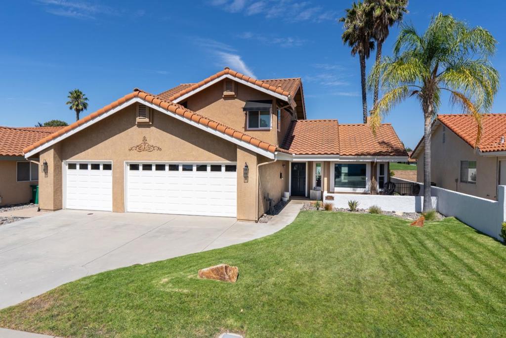 Welcome to this beautiful updated 3 bed, 2.5 bath home located on the golf course in Paso Robles. The living room is light and bright with vaulted ceilings, vinyl plank flooring, and a fireplace. An entertainers kitchen with white shaker style cabinets, soft close drawers, a farmhouse sink, quartz countertops, subway tile backsplash, pot filler and updated stainless steel appliances and a breakfast bar. The landscaped backyard backs up to hole 3 and offers a built-in pergola, a hot tub and timed evening lighting. Half bathroom and laundry room with custom bench seating, cabinets and a barn door are located downstairs. The primary suite is upstairs with a custom accent wall, vaulted ceilings, private balcony overlooking the golf course and its own primary bathroom. Inside the primary bath you will find a custom walk-in closet with plenty of storage and double vanity with a dual head walk-in shower.
