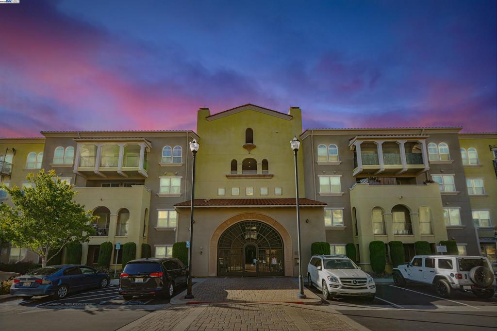 Beautiful East-facing condo in a gated community in the heart of Silicon Valley! Gourmet kitchen with granite counters, wood cabinetry, and stainless steel appliances. Spacious living room with engineered wood floors, ceiling fan, and access to a large private patio. Open floor plan with dining area, plush carpet, ample closet space, and plantation shutters. Generous-sized bedrooms, including a primary suite with a fully furnished walk-in closet and remodeled bath featuring a sunken tub and oversized shower. Inside laundry, A/C, and a brand-new HVAC system with 10-year warranty. HOA fee includes water and trash. Resort-style amenities: clubhouse, EV charging, elevators, BBQ area, fitness room, pool, sauna, playground, and lush grounds. Prime Milpitas location with easy commute to most bay area offices, near top-rated schools like Stratford, the Great Mall, parks, cafes, and major freeways (880/237/101/680), plus BART/light rail access. Safe neighborhood with two parks next door. Includes two detached garages for secure parking and extra storage. A rare blend of comfort, convenience, and priced to sell soon - don’t miss out!
