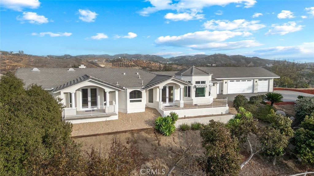 This exquisite single-story estate has been thoughtfully expanded and upgraded to deliver the finest in luxury living. Nestled on more than 11 acres with sweeping views from nearly every room, this home blends elegance, comfort, and functionality.
The residence offers 4 spacious bedrooms and 4 bathrooms, with three of the bedrooms featuring ensuite layouts for maximum comfort and privacy. Recent updates include new interior paint, newly installed luxury vinyl flooring in all bedrooms, and upgraded fixtures and ceiling fans throughout.
At the heart of the home is a state-of-the-art kitchen, complete with sleek stainless-steel appliances, modern faucets, and a dedicated dining area where you can enjoy every meal surrounded by breathtaking scenery.
The expansive 4-car garage has also been enhanced with a brand-new epoxy floor, a new garage motors, and a new water heater.
The exterior showcases fresh paint, newly added gravel landscaping accented with red bark, upgraded solar lighting, and a newly installed rolling gate with a motor and chain link fencing for security. Additional improvements include new septic risers for added peace of mind.
This remarkable property offers the perfect combination of luxury, privacy, and natural beauty. Every detail has been carefully considered, making this home a true masterpiece ready to welcome its next owner.