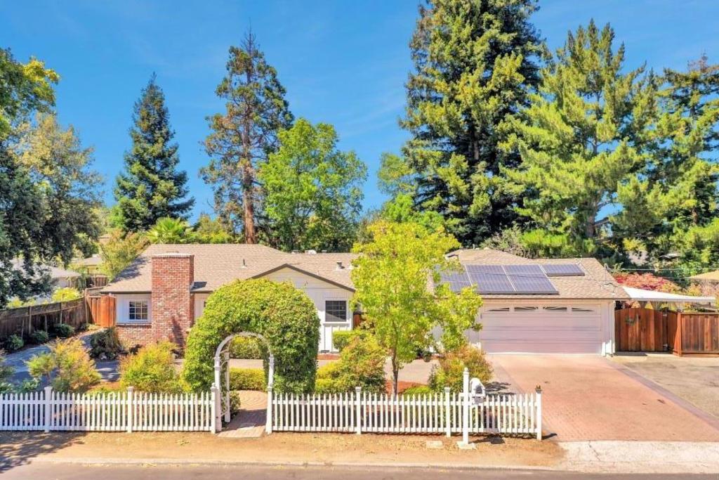 Exceptional Los Altos property with wide lot frontage, a spacious yard, and owned solar panels. The 4BD/2BA main home (1,798 sqft) and 2BD/1BA granny-unit (971 sqft, rents for $4,300/month) are perfect for multi-generational living or additional income. Remodeled kitchen and bathrooms, abundant natural light, and a functional floor plan make this home move-in ready. Located in a sought-after neighborhood with top-rated schools and close to shopping, dining, and major tech hubs. Total living space for the main home and the attached (via breezeway) granny-unit is 2,769 sqft
