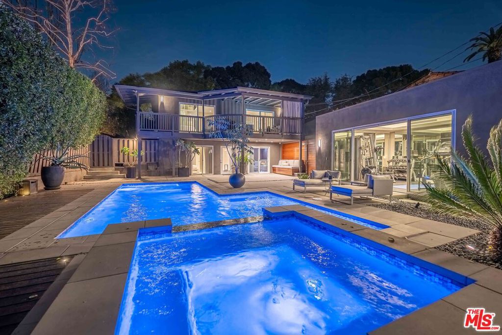 Exquisite Designer Home in the Heart of West Hollywood! This stylish home at 8610 West Knoll Drive offers a perfect blend of comfort and luxury in a great location. Designed by renowned Brazilian designer Ronny Constansi, it features an open-concept layout connecting the living, dining, and family rooms, ideal for entertaining or relaxing. The kitchen is a chef's dream, with high-end Miele appliances and white quartz countertops. The house has plenty of natural light, elegant wood floors, five bedrooms, 5 1/2 bathrooms, including two main suites with luxurious bathrooms, and a gym. It also has a private backyard with a new pool, hot tub, and an upstairs deck. The home is equipped with a Crestron home automation system for easy control of music and lighting. Located near Trader Joe's, John Reed gym, and various shops and restaurants, this home is perfect for those seeking a blend of style and convenience in West Hollywood.