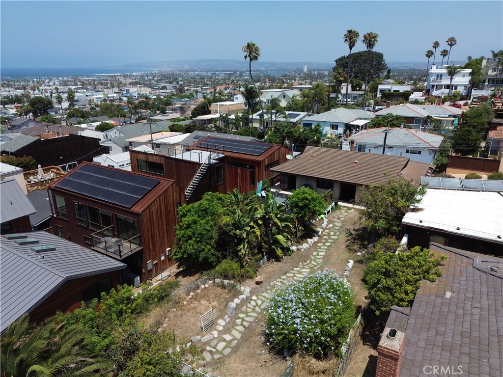 VIEWS VIEWS VIEWS!!! An exceptional opportunity for developers, investors, and anybody looking to build their DREAM home on one of the best blocks in the desirable Ocean Beach surf town. This expansive 7,000 sq ft lot is one of the few remaining open parcels in Ocean Beach, offering incredible potential in one of San Diego’s most coveted coastal communities. Located just minutes from the beach, Sunset Cliffs, and all the charm of downtown OB.
The existing home could use some TLC or complete redevelopment, making it a true blank canvas ready for vision. With alley access and a flat, usable footprint, the lot provides design flexibility for a range of possibilities: a custom single-family residence with outdoor space and parking, or a multi-unit build for long-term rental income or resale. The existing home being perfectly positioned on the back of the lot, with a 4 garage spaces underneath the house along the alley, allows for a plethora of options for the front of the lot. Add a second story and you will have unbelievable unobstructed ocean views as we are over 1 story above the lot to the West.
Whether you're a seasoned developer, investor looking for your next project, or somebody looking to own a piece of the beach life, this is the opportunity of a lifetime. Due to the favorable RM-1-1 zoning, there are many different development strategies including, splitting the lot and building two slot homes, rehabbing the back house and adding at least 3 more units, or building your dream home and keeping the back house for additional income potential.
Don't miss one of the last true buildable lots in Ocean Beach — bring your vision and unlock the full potential of this unique coastal property.
If this isn't a good fit for you, VERTIGO REAL ESTATE VENTURES constantly has new investment opportunities. Please call (619) 374-4019 to see active inventory!