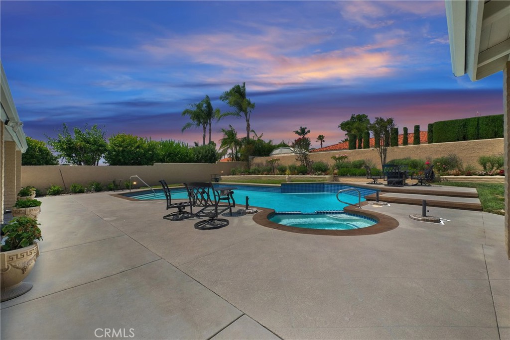 This sprawling North Upland home has it all: A great single-level layout, thoughtful updates, a backyard pool & spa and fantastic mountain views. The property also has wonderful curb appeal, with a manicured front lawn, a courtyard and raised garden beds.
Inside the stately front doors, you'll find hardwood floors, exposed timbers, brick archways and big windows that fill the space with natural light. The living room offers vaulted ceilings, a cozy fireplace and a custom wet bar. Around the corner, the gorgeous chef’s kitchen features quartz countertops, pro-style stainless appliances, island seating and a wall of storage.
Just steps away, that backyard oasis awaits! You'll spend lots of time on the long covered patio -- with space for grilling, dining & entertaining. Your guests can take a dip in the beautiful pool&spa, while Fido runs around in the lush lawn. This property also includes fruit trees and attractive garden boxes along the fence line.
Back inside, the massive primary bedroom includes a sitting area and a slider with direct access to the covered back patio. The ensuite boasts two custom walk-in closets, a granite-topped double vanity and a large shower. Down the hall from the primary suite, there are three guest rooms and a full bathroom with dual sinks.
On the other side of the house, you'll find the fifth bedroom with access to the back patio. The floorplan also offers a spacious laundry/drop zone & another full bathroom only steps from the pool deck. Don’t forget about all the bonus closet space and the additional storage in the 2-bay garage.
This home sits on a tree-lined street in an established North Upton neighborhood. It’s zoned to excellent schools, with parks and trailheads close by, too. There are lots of shopping & dining options in both directions along Historic Rt 66 (5 mins), and you can hop on the 210, 10 and 15 Fwys in no time at all.