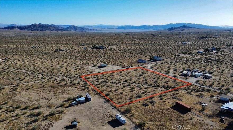 REDUCED!! ***HAULED WATER ACCESS*** Here is your chance to own 2.5 acres of prime land, just a jump, skip, and hop across the highway from the renowned King of The Hammers race grounds. Nestled in Landers on the border of Johnson Valley, this property offers a great opportunity. Beyond its 2.5 acres of land, it presents a lifestyle where convenience meets practicality. With power access readily available from the power poles running in front of the property, and the potential for a water well installation for your water service, this plot is primed for development. Can't drill a well yet?  This property has access to Bighorn Desert View Water Company's bulk water hauling stations!  Haul your own water in until you can afford to drill your own well!!  This location provides excellent access to multiple neighboring cities. It is just one street away from Ocotillo Rd, which connects you to Old Woman Springs Rd for a quick commute into Yucca Valley, Joshua Tree, 29 Palms, and the 10 freeway to Palm Springs. Alternatively, take Ocotillo Rd west to Larrea Rd and head towards Lucerne Valley, Big Bear, Barstow, and the 15 freeway. Drive by and see what this location has to offer you! Don't miss out on creating your perfect desert getaway or investment opportunity!

This property does not have an address assigned. "702 Bell Rd" is for listing purposes only

APN# 0454-191-72-0000

Coordinates: 34.348660 / -116.553023