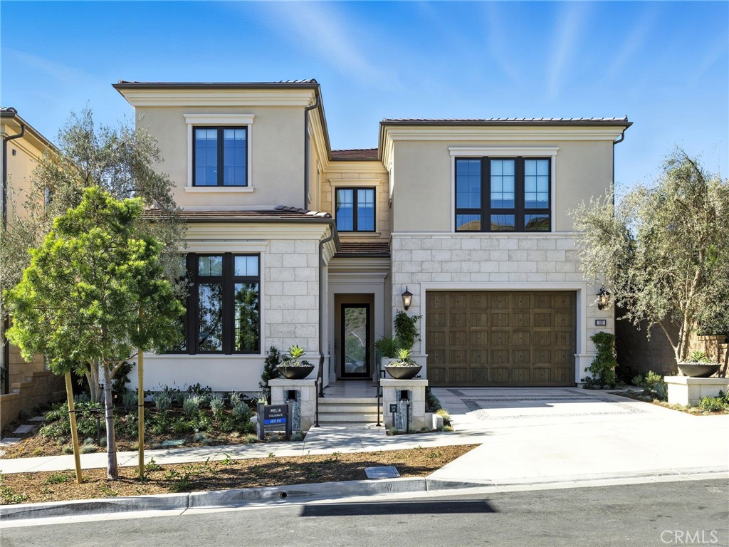 Welcome to Skyline in Summit at Orchard Hills by Toll Brothers, a new community in Irvine. Homesite 66 is a new construction home that is situated on the very top and offers enhanced privacy and elevated views of city lights stretching toward Newport Beach and Catalina Island. Melia floor plan, Spanish exterior, 5 ensuite bedrooms, 5.5 baths, approx. 4,879 sq. ft. of living space on a 6,176 sq. ft. homesite, with 2-car garage. At the front of the home, a stylish multi-gen suite, living area, and storage area provide plenty of privacy. A welcoming two-story foyer reveals the spacious great room complete with a fireplace and access to the beautiful luxury outdoor living space. The bright casual dining area is open to a well-appointed kitchen that features an expansive island with breakfast bar, a walk-in pantry, and ample counter, cabinet space, Wolf® and Sub-Zero® appliances. On the second floor, an airy loft provides versatile space for entertaining. The serene primary bedroom is enhanced by a roomy walk-in closet and a tranquil bath with dual vanities, a relaxing soaking tub, a luxe shower with seat, linen storage, and a private water closet. Three lovely secondary bedrooms provide private baths and walk-in closets. Additional highlights include a first-floor powder room, an everyday entry with drop zone off the garage, bedroom-level laundry, and extra storage throughout. Estimated completion is Summer 2026, presenting a limited opportunity in Irvine’s most desirable staff-gated hillside community. Residents enjoy access to resort-style amenities, saltwater pools, parks, and acclaimed Irvine schools. Buyers still have time to personalize cabinets, countertops, and flooring. Photos are of the model home; actual home is under construction.
