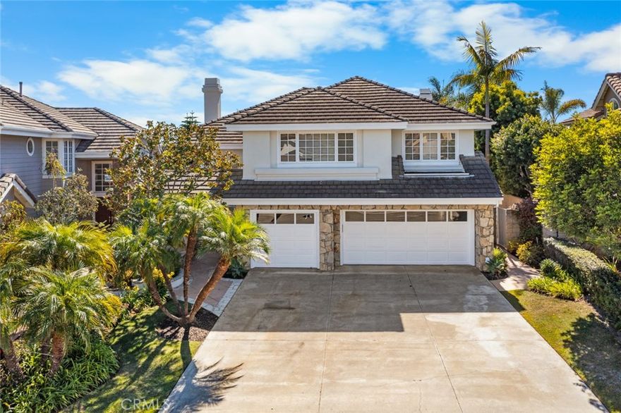 Experience refined coastal living in this stunning two-story home located in the highly desirable San Marin community, one of the area’s most affluent and picturesque neighborhoods. This spacious 4-bedroom, 3-bath residence also includes a dedicated office that can easily serve as a 5th bedroom, offering the perfect blend of flexibility and comfort for today’s modern lifestyle. Step inside to soaring high ceilings that fill the living room with natural light and highlight the home’s open, elegant design. Enjoy two inviting living areas, each featuring its own fireplace, along with a third fireplace in the primary suite—ideal for relaxing evenings. The kitchen is in excellent condition and thoughtfully designed with ample pantry space, a center island, microwave, refrigerator, double oven, and dishwasher, making it both functional and stylish. A separate laundry room (washer and dryer not included) provides added convenience. Upstairs, the primary bedroom suite impresses with a fireplace and beautiful views, while the ensuite bathroom offers Jack-and-Jill sinks, a soaking tub, separate shower, and a walk-in closet. Outside, the backyard is perfect for entertaining or unwinding, complete with a covered patio, grassy area, and a built-in barbecue island surrounded by generous counter space. Additional features include a three-car garage with double and single doors, a wide driveway, and timeless curb appeal that complements the prestige of its location. Ideally situated just minutes from the ocean, this home combines luxury, comfort, and an unbeatable coastal lifestyle.