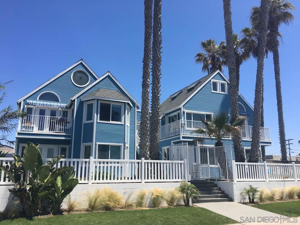 Stunning OB Ocean View Stay Enjoy breathtaking ocean and sunset views from this stylish 3BR/2BA retreat just steps from the sand in Ocean Beach. With wide-plank wood floors, upscale coastal décor, and an open layout, this spacious unit sleeps 8 and offers ocean views from the living room, kitchen, and balcony. The rooftop deck showcases 360° coastal panoramas—perfect for relaxing or entertaining. Perched right on the sand, the home overlooks the Pacific, Ocean Beach Pier, and coastal wildlife. Whether you’re in the living room, dining area, or private balcony, the coastline is always in view. Designed with a relaxed yet sophisticated beach aesthetic, it features a gourmet kitchen with recycled glass countertops, stainless steel appliances, gas stove, and everything needed for home-cooked meals. A balcony BBQ invites al fresco dining, while the cozy living room with gas fireplace and flat-screen TV welcomes downtime after a day in the sun. The grand king suite includes a private bath, while the queen bedroom offers scenic views. A spiral staircase leads to a loft with trundle bed and French doors opening to the rooftop deck. An adjacent twin room completes the setup, ideal for families or groups. Steps from sand, dining, shopping, and nightlife, this oceanfront gem is the ultimate getaway. STR-11236L | TOT-617561