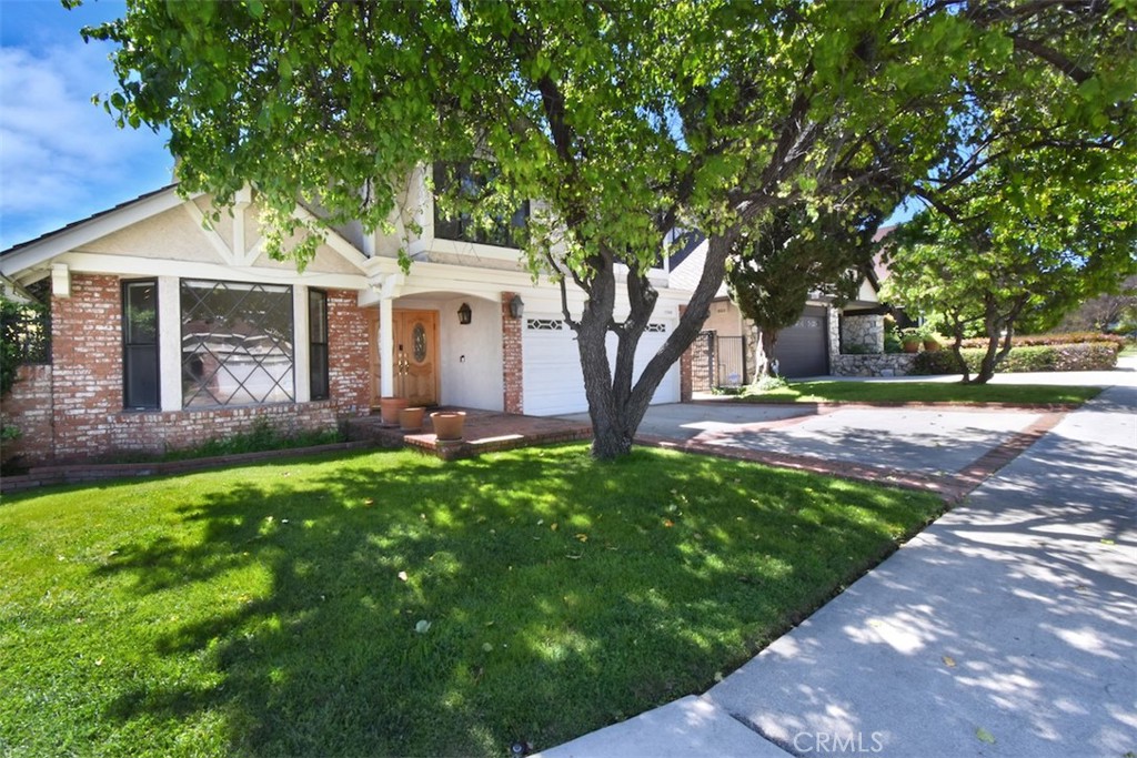 Discover the epitome of pride of ownership in this exquisite Encino residence, nestled on a serene cul-de-sac within the coveted Amestoy Estates. Step inside to an expansive open floor plan, where high vaulted ceilings and gleaming hardwood floors create an immediate sense of grandeur. The bright, cheerful kitchen, featuring granite counters, is an entertainer's dream, flowing seamlessly into the formal dining room and a family room that opens directly to the lush, tranquil backyard. Upstairs, the spacious primary suite is a private sanctuary, boasting a dry sauna, spa tub, dual sinks, a dedicated dressing area, and dual walk-in closets. Two generously sized additional bedrooms complete the second level, while dual-zone A/C ensures year-round comfort. This home's exceptional layout is perfect for both raising a family and grand entertaining. Its unbeatable location places you moments from Encino Park, Balboa Park, tennis courts, and the enchanting Japanese Garden. With award-winning schools like Encino Charter Elementary nearby, and immediate access to Ventura Boulevard's vibrant shops and restaurants, plus convenient freeway access (101 & 405) and proximity to UCLA, this move-in ready gem offers an unparalleled lifestyle. First level bedroom was converted to public space but can be easily converted back. Some furniture is negotiable with the sale.